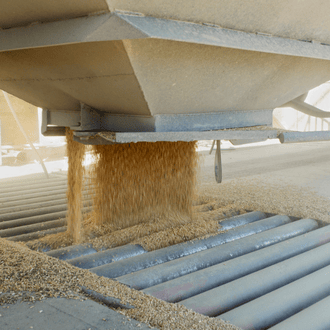 Quality swine feed ingredients are unloaded at a feed mill.