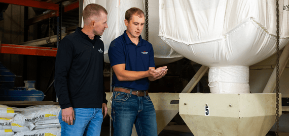 A nutritionist and financial advisor discuss the quality of a pig feed product.
