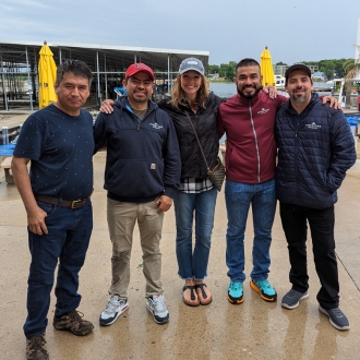 A group of pipestone workers at an event outside.