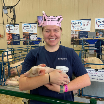 A swine intern holds a piglet during the Sioux Empire Fair.